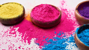 Yellow, pink, blue and purple colour powder for events