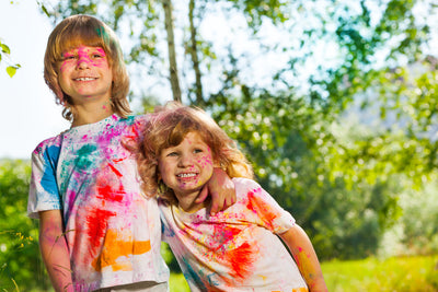 Crowd celebrating with clouds of color powder at a festival